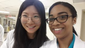 two smiling medical students