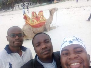 Denis and friends after riding a camel